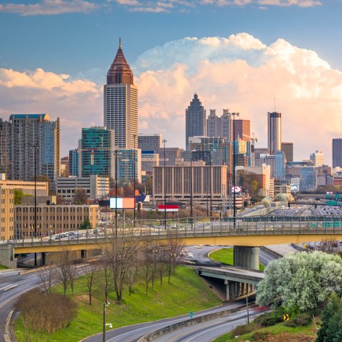 Atlanta, Georgia, USA downtown city skyline over highways at dusk.