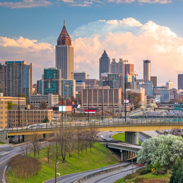 Atlanta, Georgia, USA downtown city skyline over highways at dusk.